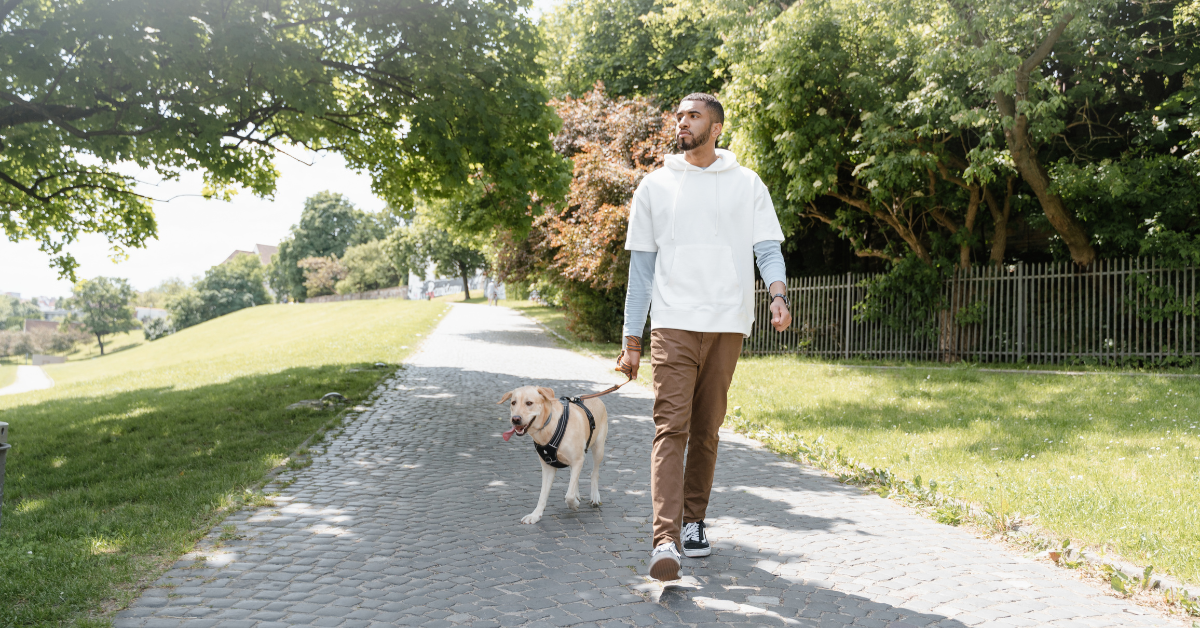 man walking dog in Atlanta, GA park